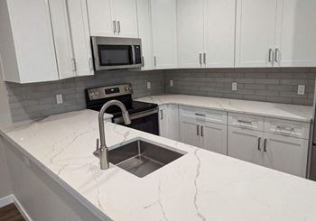kitchen with white stone at The Point at Gateways, Randolph New Jersey  
